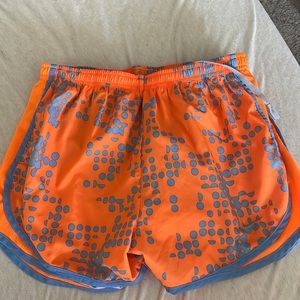 Orange and blue Nike running shorts